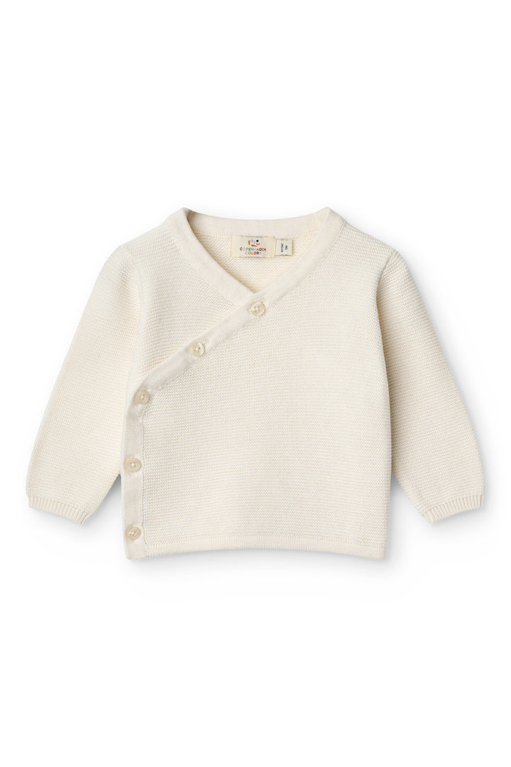 Bomuldsstrikket Baby cardigan m. skrå sidelukning - CREAM