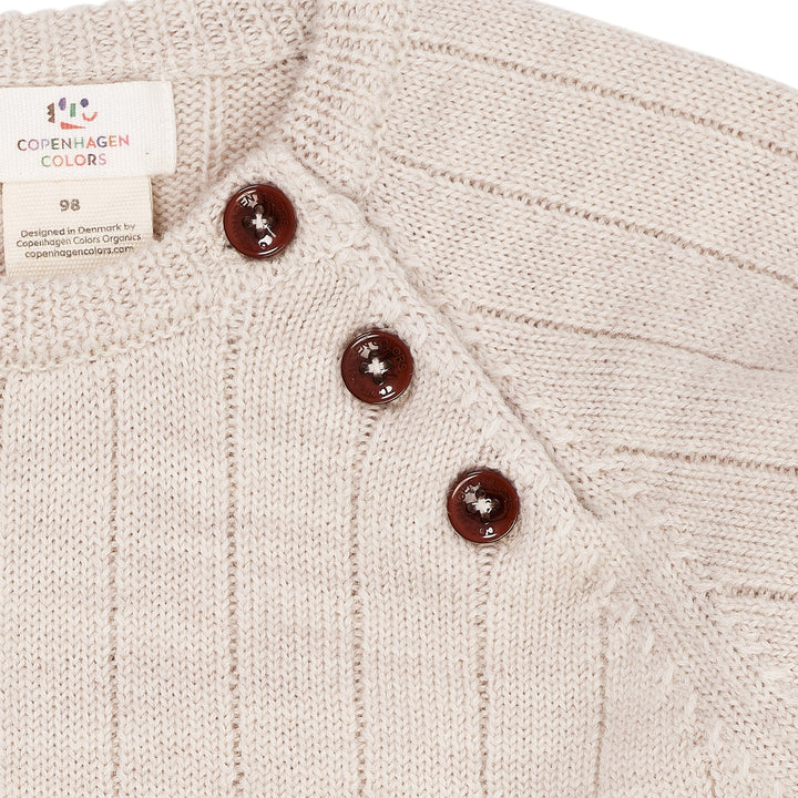 STRIKKET BLUSE I MERINOULD M. KNAPLUKNING OVER SKULDER - PALE CREAM MELANGE